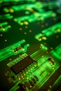 Detail of a microprocessor, resistors and capacitors soldered to a green glowing PCB Royalty Free Stock Photo