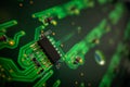 Detail of a microprocessor, resistors and capacitors soldered to a green glowing PCB Royalty Free Stock Photo