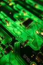 Detail of a microprocessor, resistors and capacitors soldered to a green glowing PCB Royalty Free Stock Photo