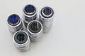 Detail of microscope lens on an white background.Closeup of microscope objectives. Royalty Free Stock Photo