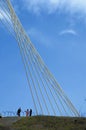 Detail of modern bridge with people at botom Royalty Free Stock Photo