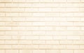 Detail of modern cream brick wall background photo. Brown light brick wall texture background for stone tile block painted in Royalty Free Stock Photo