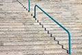 Detail of a modern curved stone staircase with metal bannister Royalty Free Stock Photo