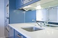 Detail of a modern kitchen in metalic blue Royalty Free Stock Photo