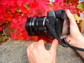 Modern mirrorless camera with professional lens taking photos