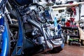 Detail on a modern motorcycle in the workshope. Motorcycle Exhaust. selective focus Royalty Free Stock Photo