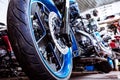 Detail on a modern motorcycle in the workshope. Motorcycle Exhaust. selective focus Royalty Free Stock Photo