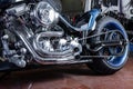 Detail on a modern motorcycle in the workshope. Motorcycle Exhaust. selective focus Royalty Free Stock Photo