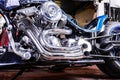 Detail on a modern motorcycle in the workshope. Motorcycle Exhaust. selective focus Royalty Free Stock Photo