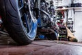 Detail on a modern motorcycle in the workshope. Motorcycle Exhaust. selective focus Royalty Free Stock Photo