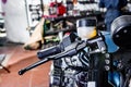 Detail on a modern motorcycle in the workshope. Motorcycle Exhaust. selective focus Royalty Free Stock Photo