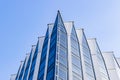 Details of office building exterior. Business buildings skyline looking up with blue sky. Modern architecture apartment. High tech Royalty Free Stock Photo