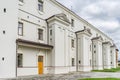 Detail of modern residential flat apartment building exterior. Fragment of new luxury house and home complex. Yellow sunlight. Royalty Free Stock Photo