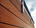 Detail of a modern wood and stainless fence.