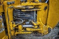 Detail of modern yellow excavator machines. Royalty Free Stock Photo
