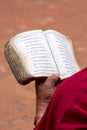 Detail of a Monk reading religious old book Royalty Free Stock Photo