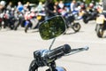 Detail on a motorcycle handlebar with mirror