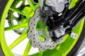 Detail Motorcycle wheel in black and green with ABS brakes
