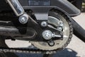 Detail of a motorcycle wheel, swingarm, sprocket and rear drive chain Royalty Free Stock Photo