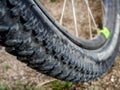 Detail of a mountain bike wheel and tire with blurred background Royalty Free Stock Photo