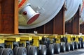 detail of a multi wheeled heavy haulage vehicle with a huge refinery vessel on board.