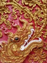 Detail of Naga golden dragon head with big white teeth Royalty Free Stock Photo