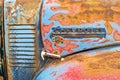 Detail of the nameplate and hood latch on a 1949 Chevy truck in a junkyard in Idaho, USA - July 26, 2021