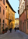 Detail of narrow street in old historic alley in the medieval village of Sansepolcro near city of Arezzo in Tuscany,