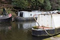 Detail of narrowboats and barges moored on a canal