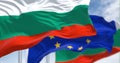 Detail of the national flag of Bulgaria waving in the wind with blurred european union flag in the background on a clear day Royalty Free Stock Photo