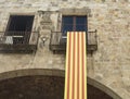 Detail of national flag of Catalonia hanging on a balcony from t
