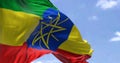 Detail of the national flag of Ethiopia waving in the wind on a clear day