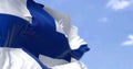 Detail of the national flag of Finland waving in the wind on a clear day