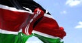 Detail of the national flag of Kenya waving in the wind on a clear day Royalty Free Stock Photo