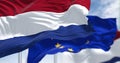 Detail of the national flag of the Netherlands waving in the wind with blurred european union flag in the background