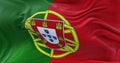 Detail of the national flag of Portugal flying in the wind.