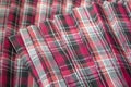 Detail of new fashion plaid pleated skirt: red, maroon, gray tartan school uniform fabric cotton/woolen material Royalty Free Stock Photo