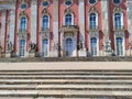 Detail of newer baroque palace with french windows and pink facade and Sanssouci park