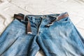 Detail of nice blue jeans with belt Royalty Free Stock Photo