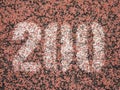 Detail of number painted on running retrack. Red track