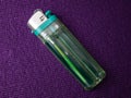 detail of object a green plastic lighter, gas lighter concept Royalty Free Stock Photo