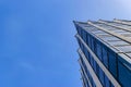 Detail of office building exterior. Business buildings skyline looking up with blue sky. Modern architecture apartment. High tech Royalty Free Stock Photo