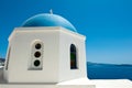 Detail of Oia church with blue cupola on the island of Thera (Santorini). Royalty Free Stock Photo