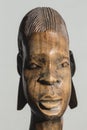 Detail of the old African sculpture of the woman