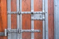 Detail of an old ancient castle wooden door with a beautiful iron knock handle.