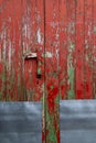Detail of an antique wooden door painted green and red Royalty Free Stock Photo