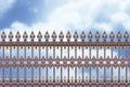 Detail of an old cast iron gate in Wien Austria - Europe against a clody sky - concept image Royalty Free Stock Photo