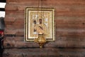 Detail from the Old Christian Church - The candle and the sacred icon on ancient wall of the Orthodox temple.