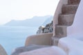 Detail of old church dome with blurred Greek building and seascape, Oia, Santorini, Greece Royalty Free Stock Photo