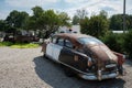 Detail of an old classic Nash Motors Statesman Super Fastback Airflyte police car outside